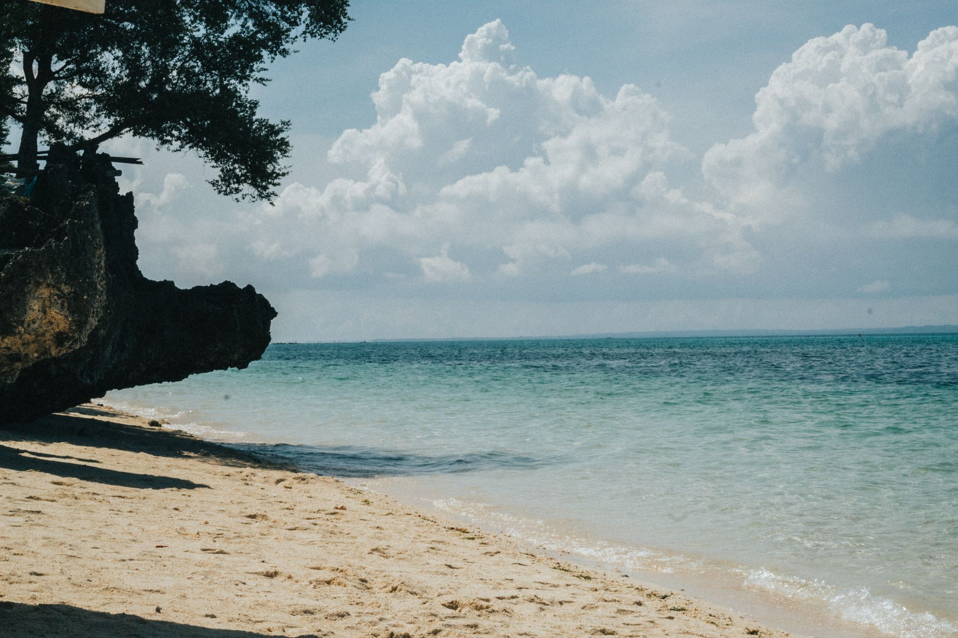 Surfboard on golden sand